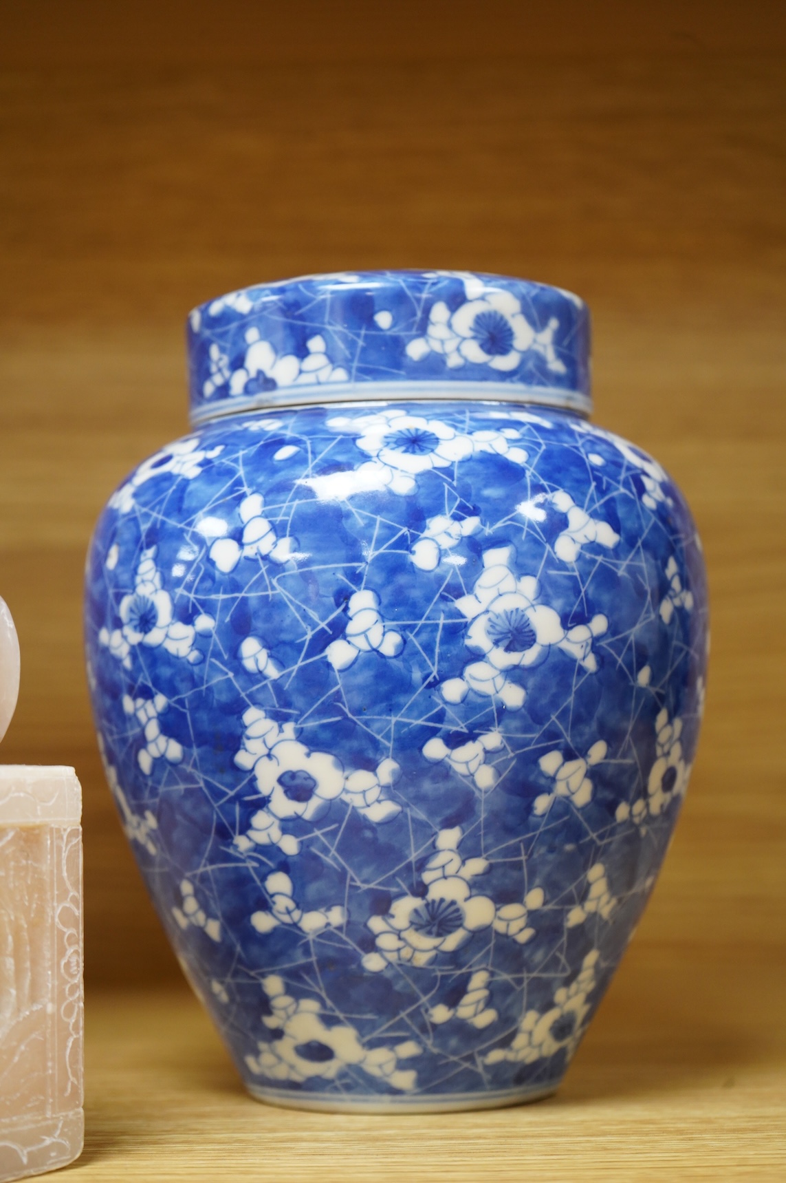 A pair of Chinese soapstone lion-dogs - 22.5cm high, two cloisonné enamel boxes and covers and a blue & white jar & cover